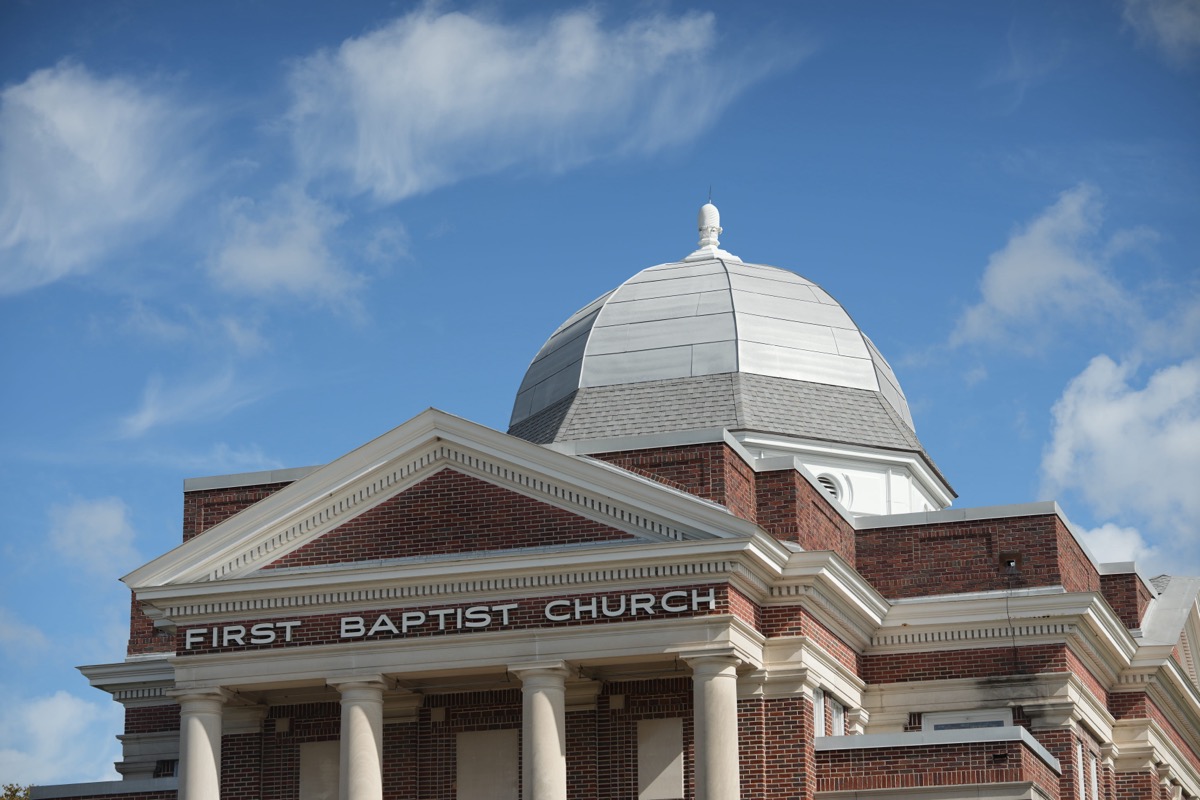 Shoppers at a bright retail store grand opening