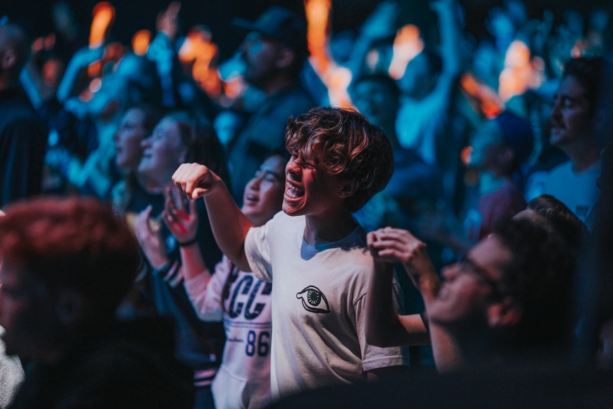Basketball arena filled with fans cheering during a playoff game