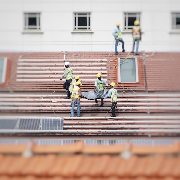 Community volunteers building a home