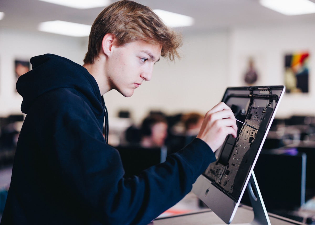 Laptop computer open on a school desk